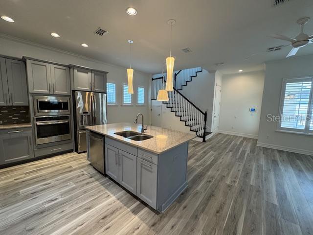 1515 Resolute Street Celebration, FL 34747 - Photo 3 of 39 a kitchen with wooden floors and cabinets