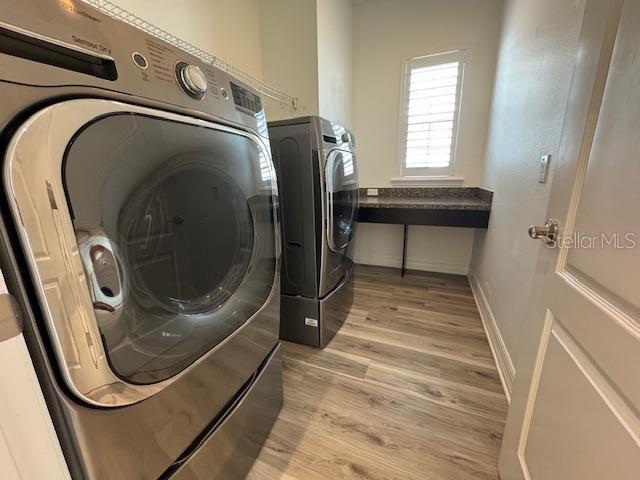 1515 Resolute Street Celebration, FL 34747 - Photo 32 of 39 a utility room with dryer and washer