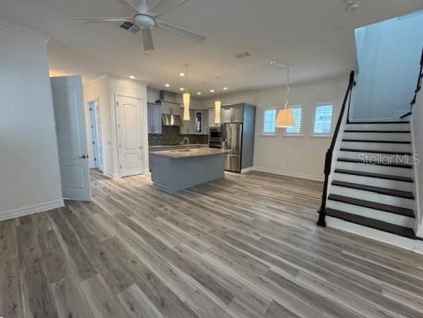 1515 Resolute Street Celebration, FL 34747 - Photo 4 of 39 a view of kitchen and empty room with wooden floor