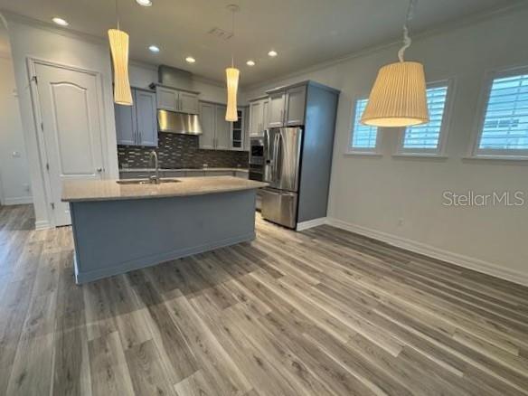 1515 Resolute Street Celebration, FL 34747 - Photo 5 of 39 a view of kitchen view wooden floor and window