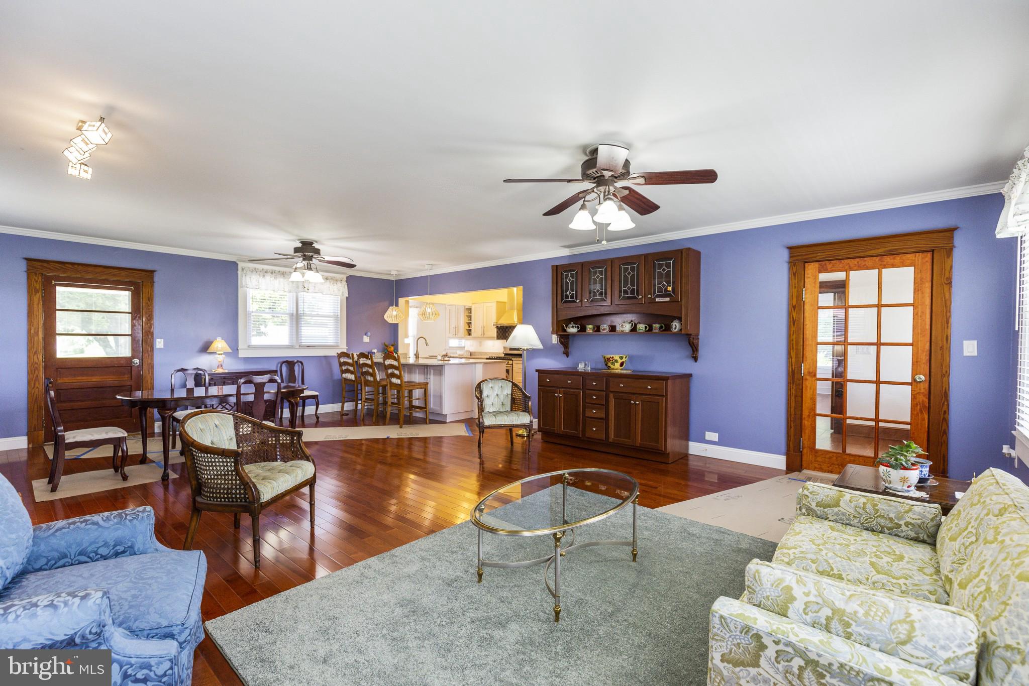 14236 Solomons Island Road South Solomons, MD 20688 - Photo 12 of 40 Living Room, Hardwood floors and Fire Place