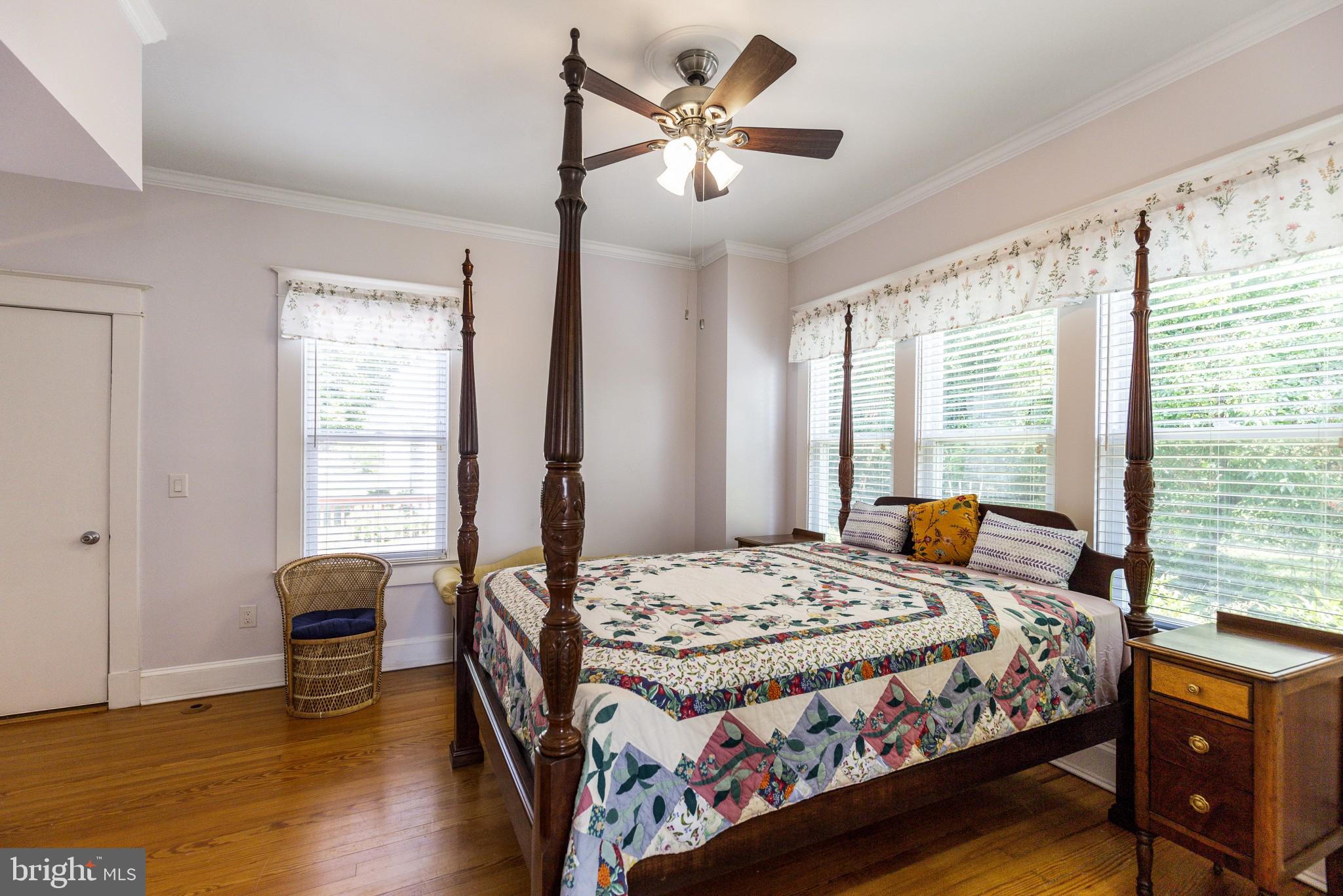 14236 Solomons Island Road South Solomons, MD 20688 - Photo 19 of 40 Master bedroom with hardwood floors