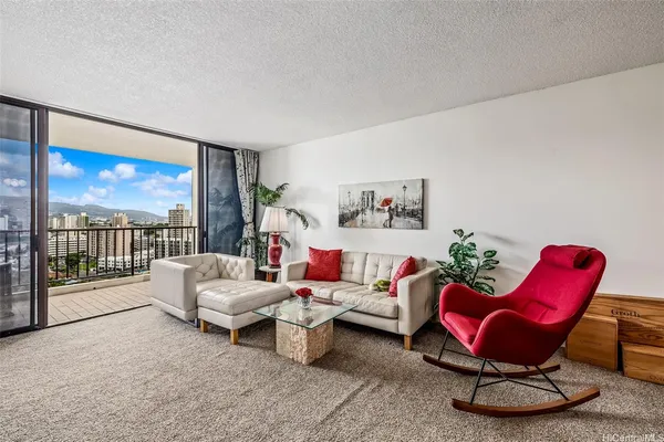 a living room with furniture a rug and a large window