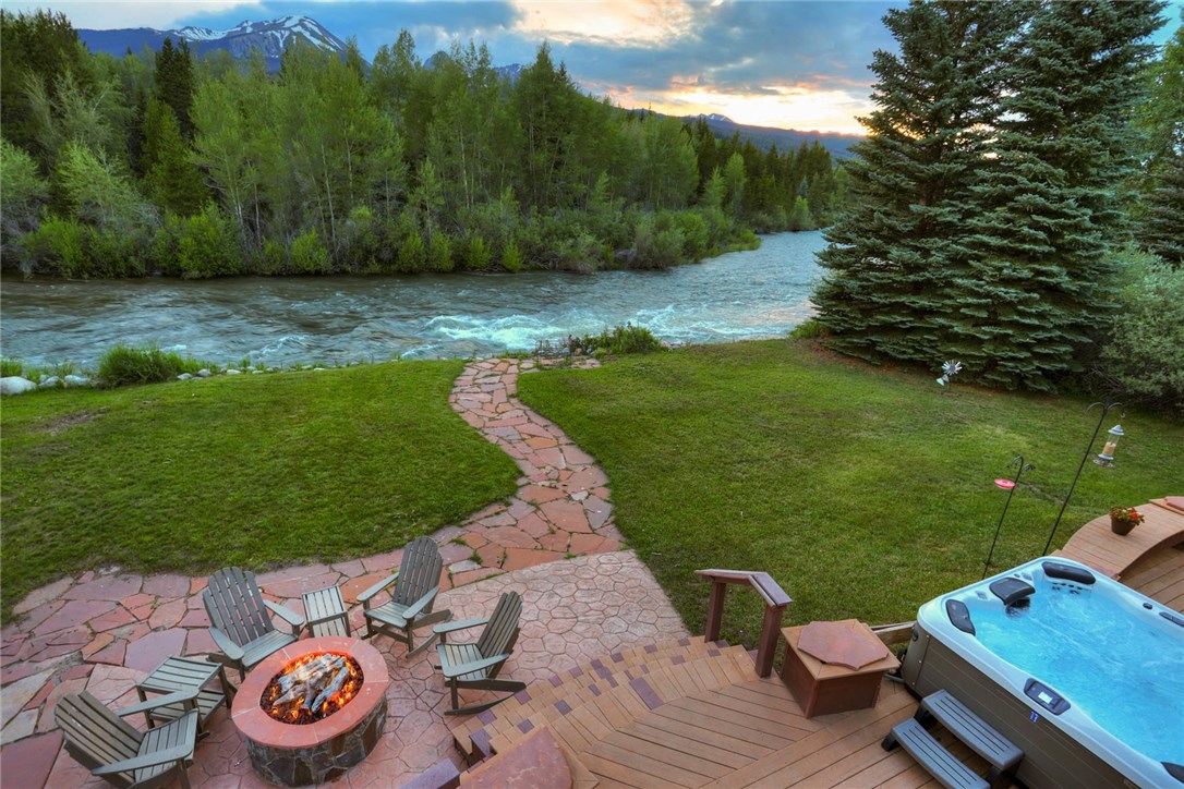 385 Riverside Drive Silverthorne, CO 80498 - Photo 28 of 35 View from the upper deck. These western views over the river to the mountains are unrivaled!