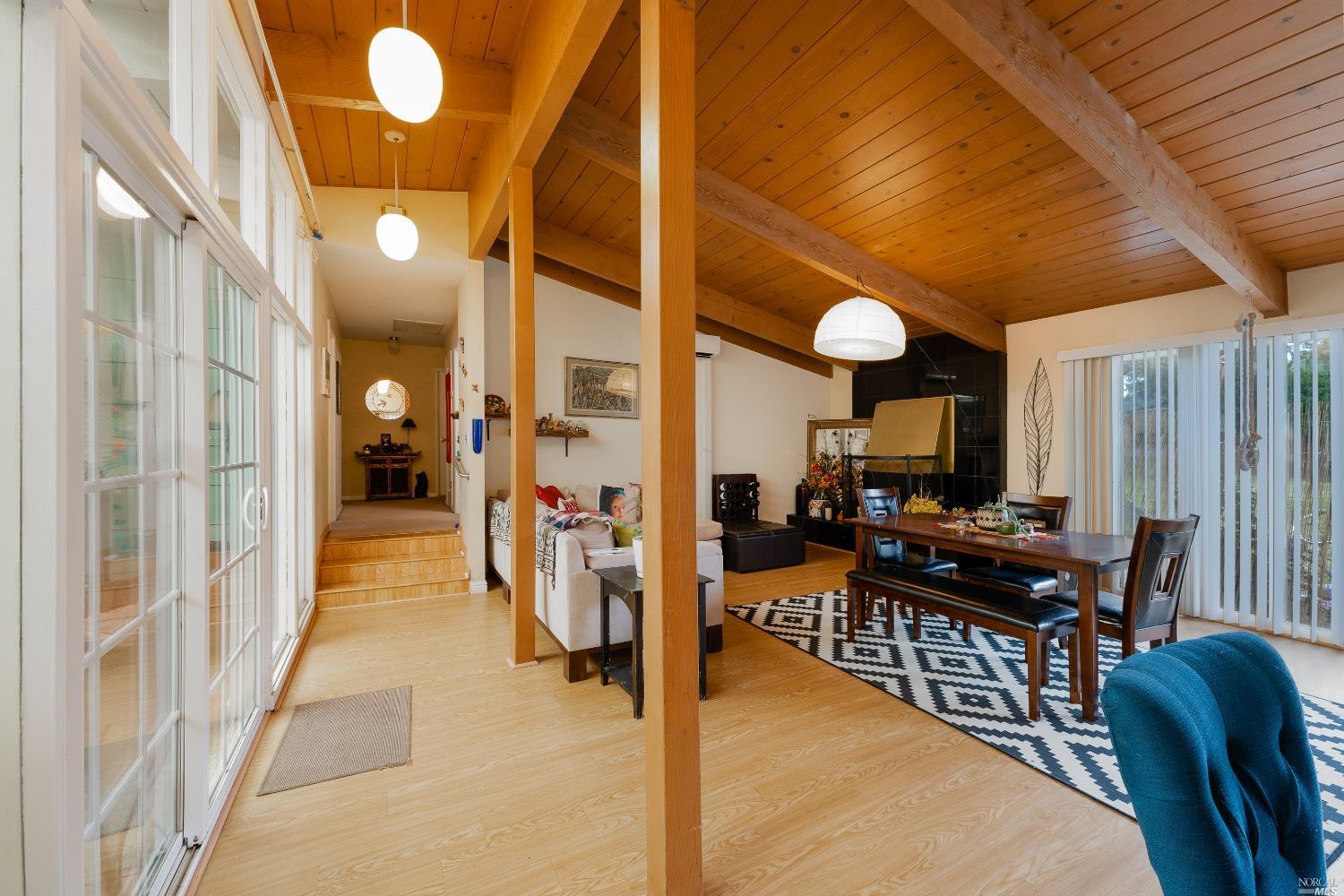 a view of a living room and dining room