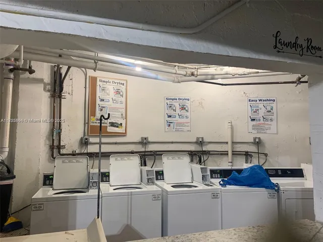 a kitchen with cabinets a sink and appliances
