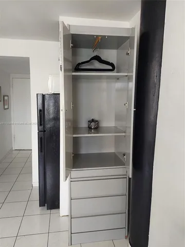 a refrigerator freezer sitting in a kitchen