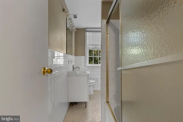 a bathroom with a sink and shower