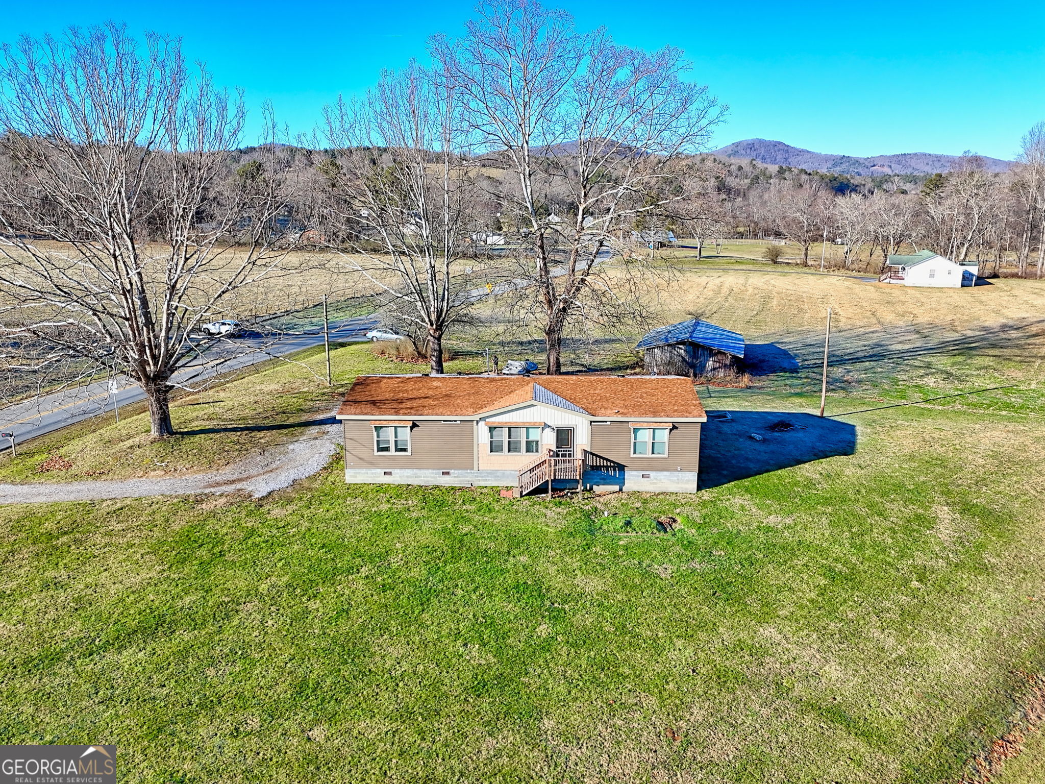 42 Jones Creek Road Blairsville, GA 30512 - Photo 13 of 56 a view of a house with a yard and lake view