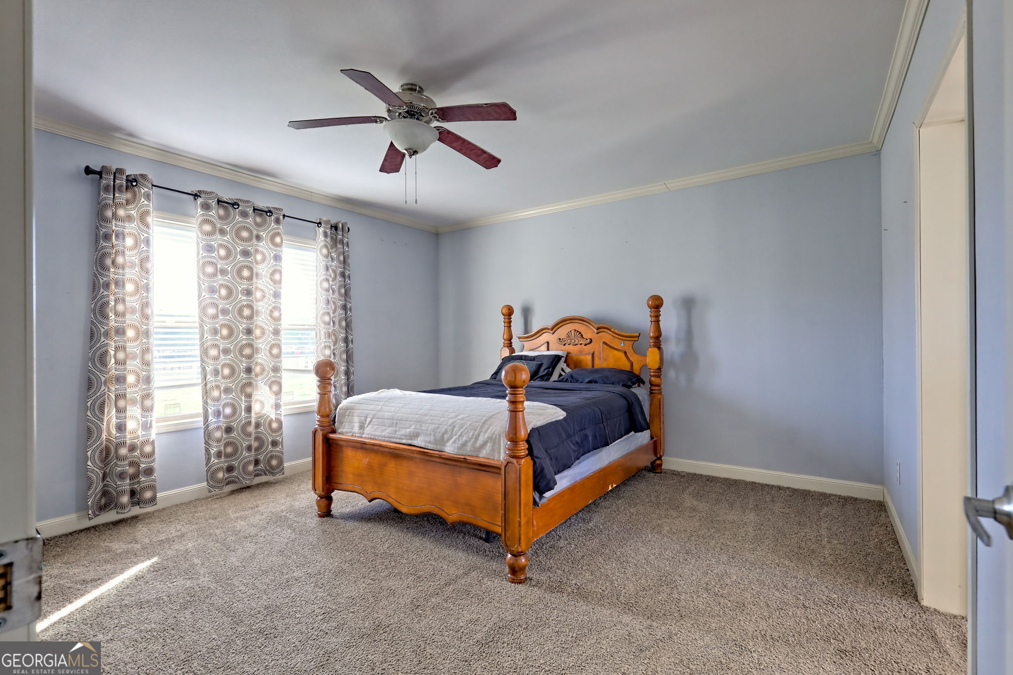 42 Jones Creek Road Blairsville, GA 30512 - Photo 26 of 56 a bedroom with a bed and window