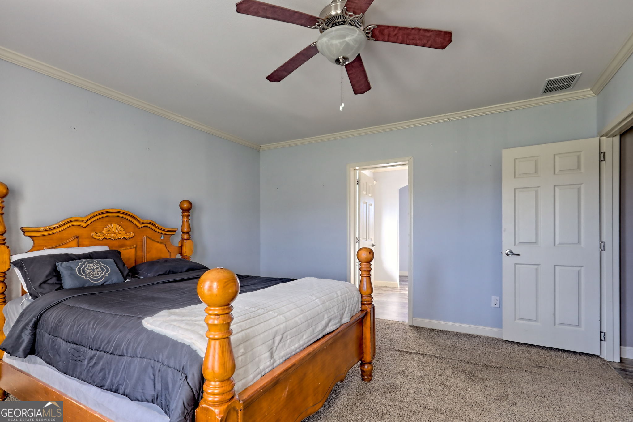 42 Jones Creek Road Blairsville, GA 30512 - Photo 28 of 56 a bedroom with a bed and wooden floor