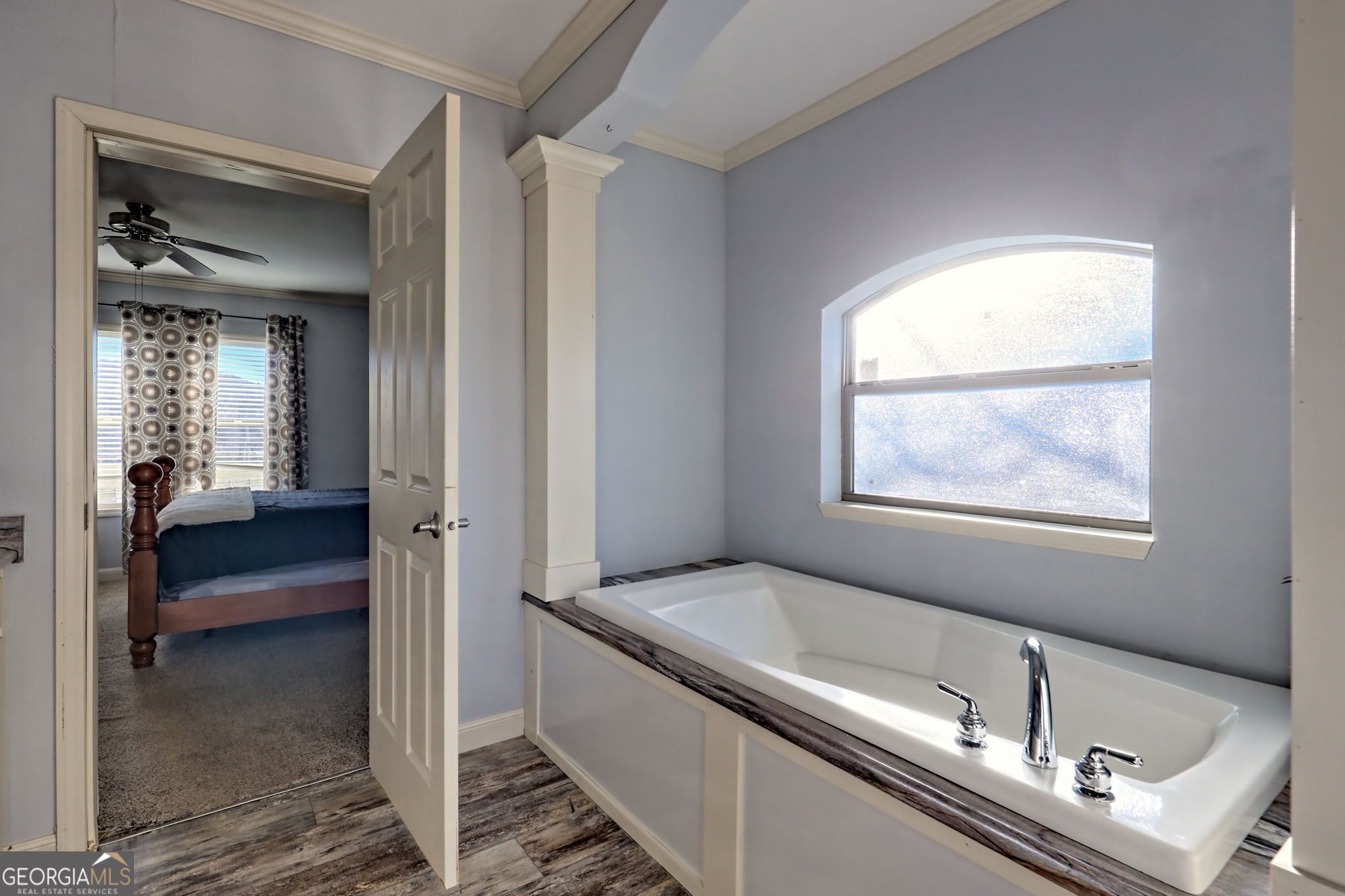 42 Jones Creek Road Blairsville, GA 30512 - Photo 34 of 56 a en suite bathroom with a granite countertop sink and a mirror