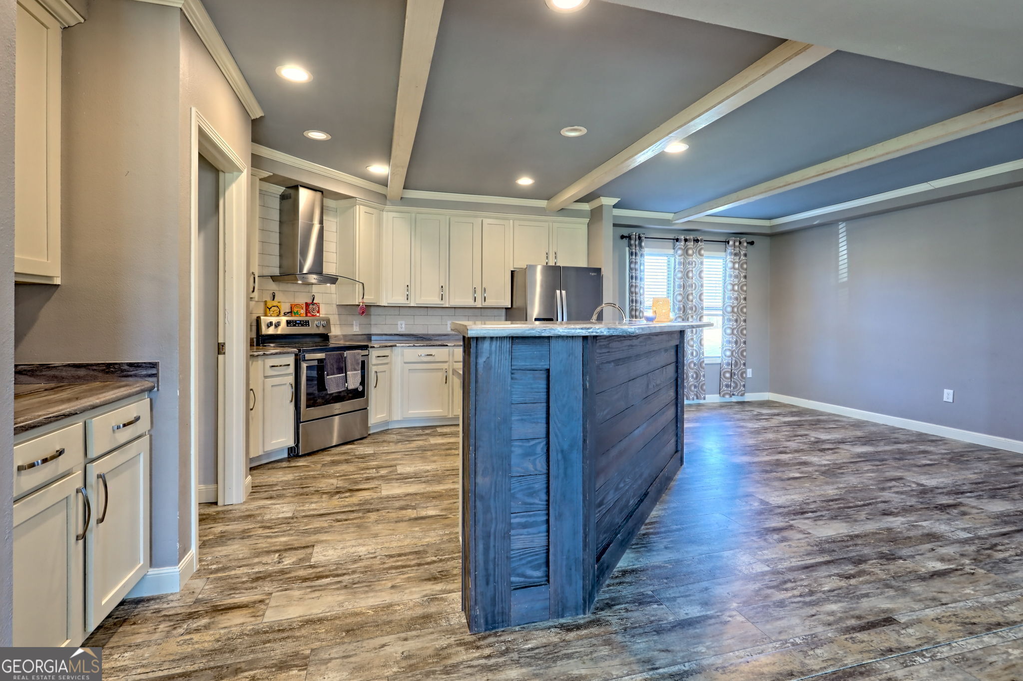 42 Jones Creek Road Blairsville, GA 30512 - Photo 43 of 56 a large kitchen with wooden floors stainless steel appliances and cabinets