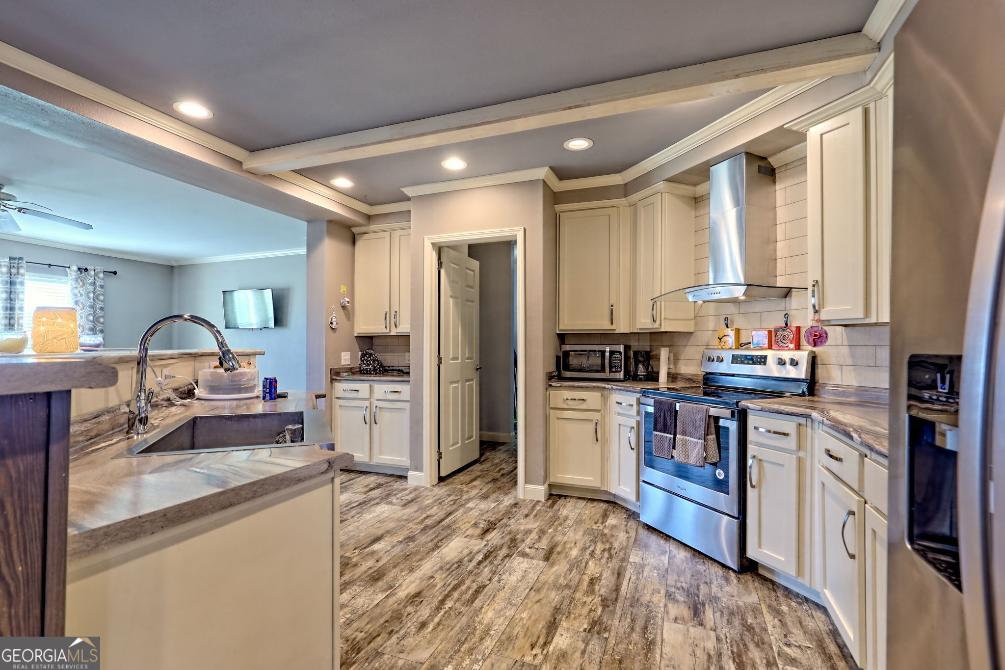 42 Jones Creek Road Blairsville, GA 30512 - Photo 46 of 56 a kitchen with a sink stove and refrigerator
