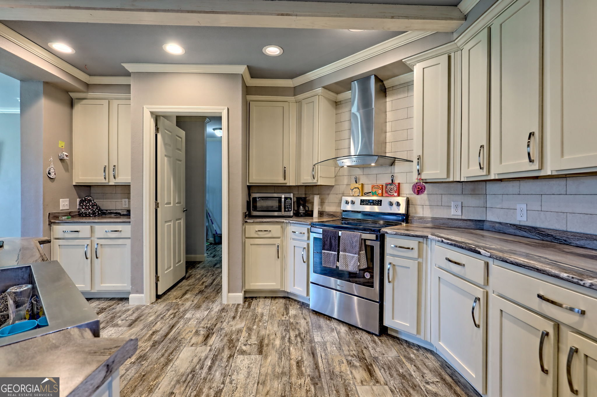 42 Jones Creek Road Blairsville, GA 30512 - Photo 47 of 56 a kitchen with granite countertop a refrigerator stove top oven and sink