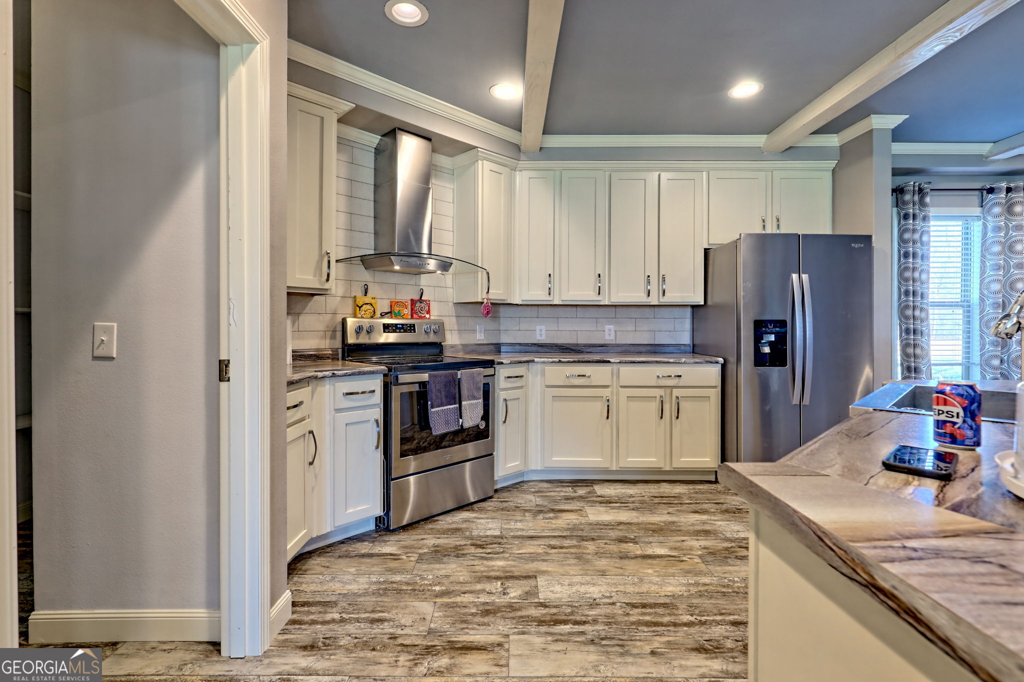 42 Jones Creek Road Blairsville, GA 30512 - Photo 50 of 56 a kitchen with a sink stove and refrigerator