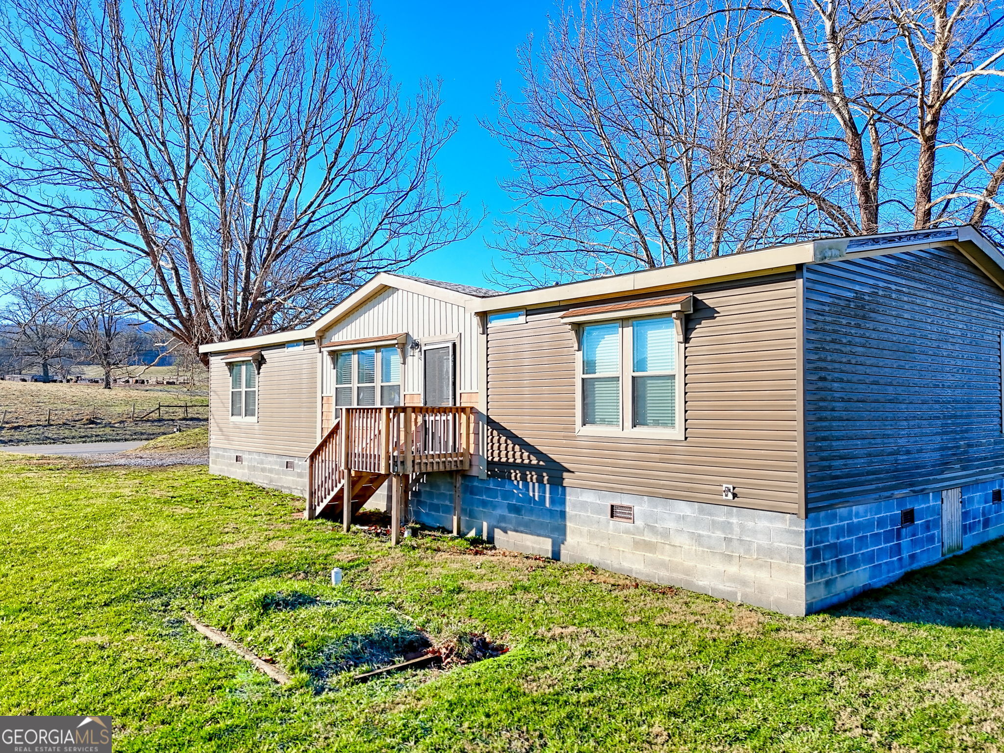 42 Jones Creek Road Blairsville, GA 30512 - Photo 5 of 56 a front view of a house with a yard