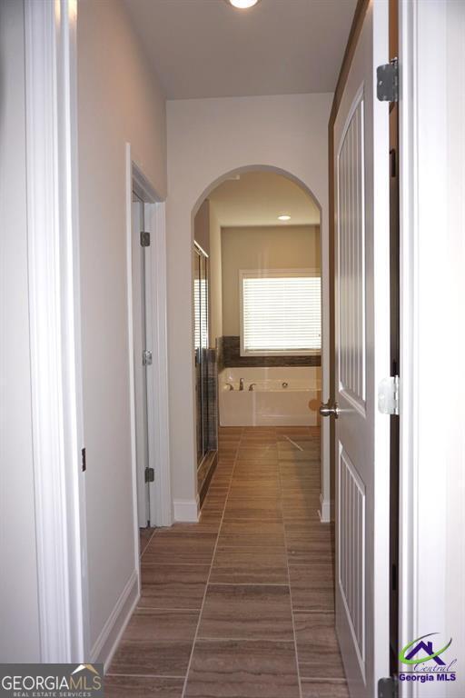 121 Bluecoat Trail Byron, GA 31008 - Photo 18 of 45 a view of a hallway with a wooden door