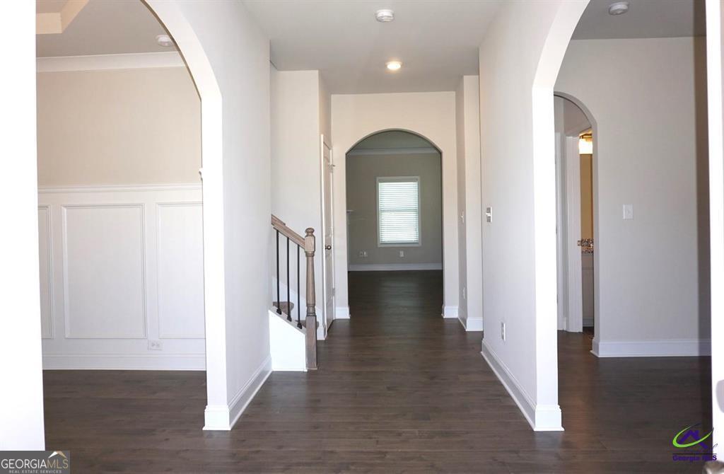 121 Bluecoat Trail Byron, GA 31008 - Photo 39 of 45 a view of a hallway with wooden floor and staircase