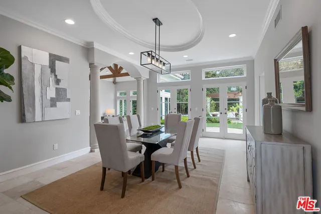 a reading room with furniture a bookshelf and a window