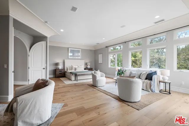 a living room with furniture and windows