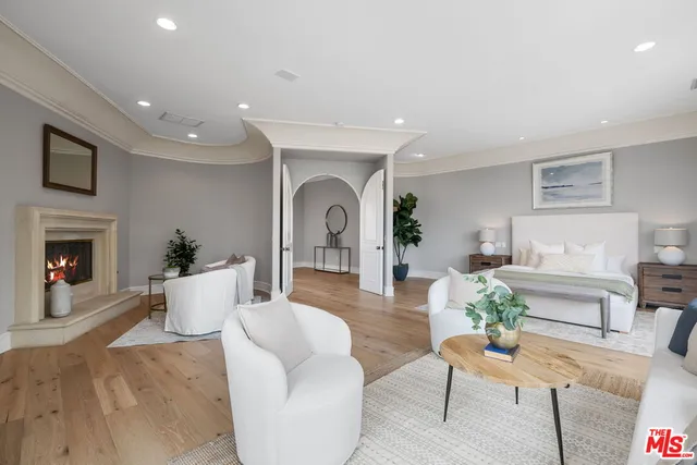 a large bathroom with a large tub and sink