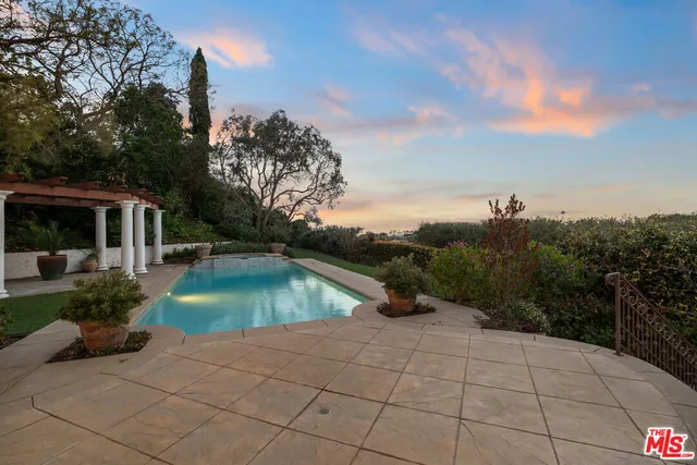 a view of swimming pool from a patio