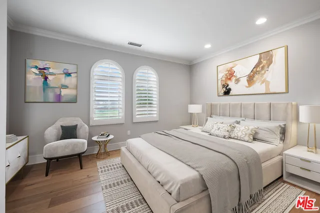 a bedroom with a bed and a couch