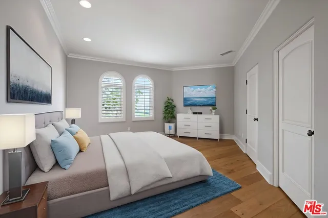 a bathroom with a bathtub shower sink mirror and toilet
