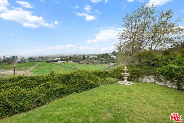 a view of a house with a swimming pool