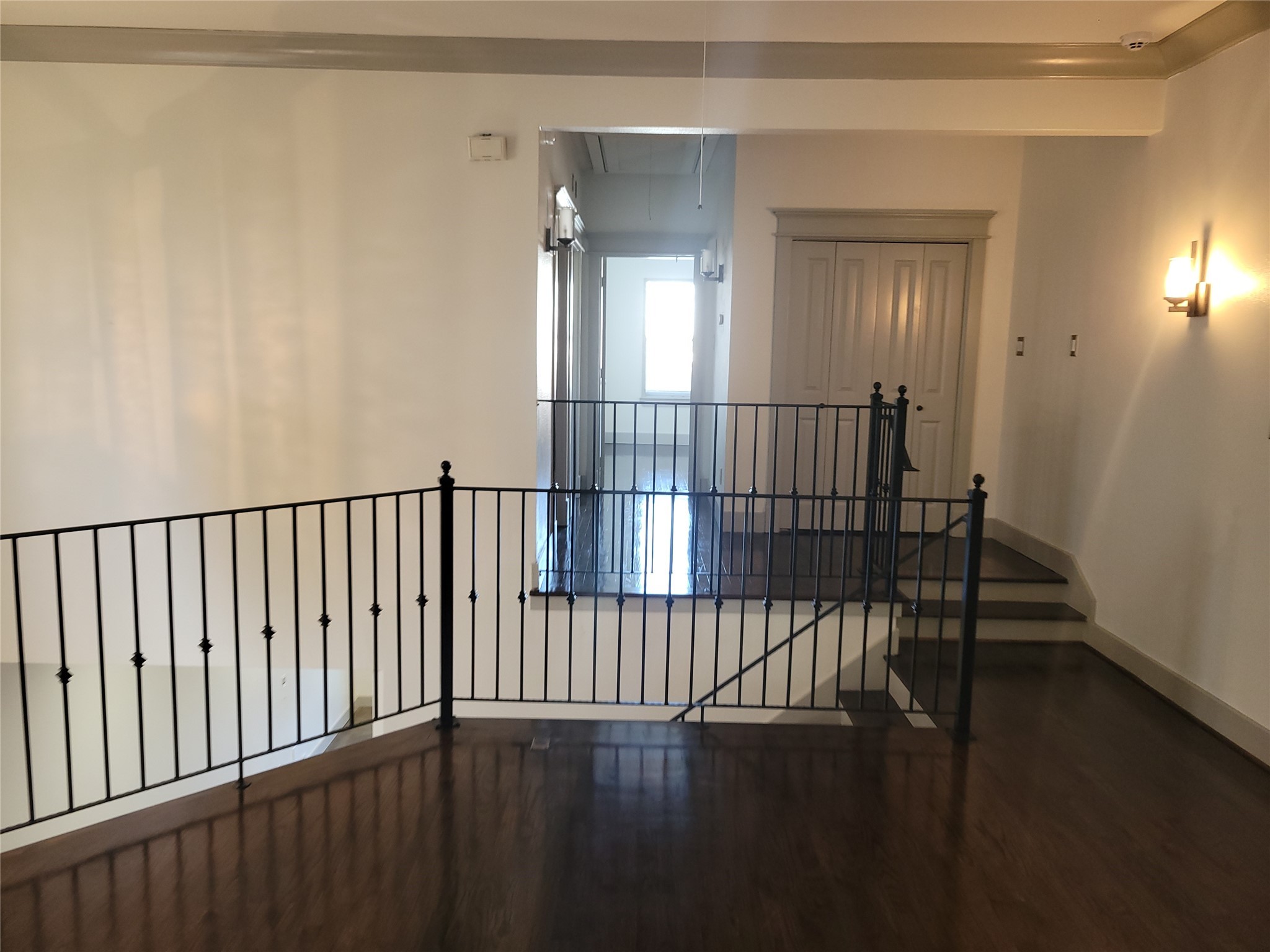 4914 Rose Street Houston, TX 77007 - Photo 15 of 36 a view of staircase with railing and wooden floor