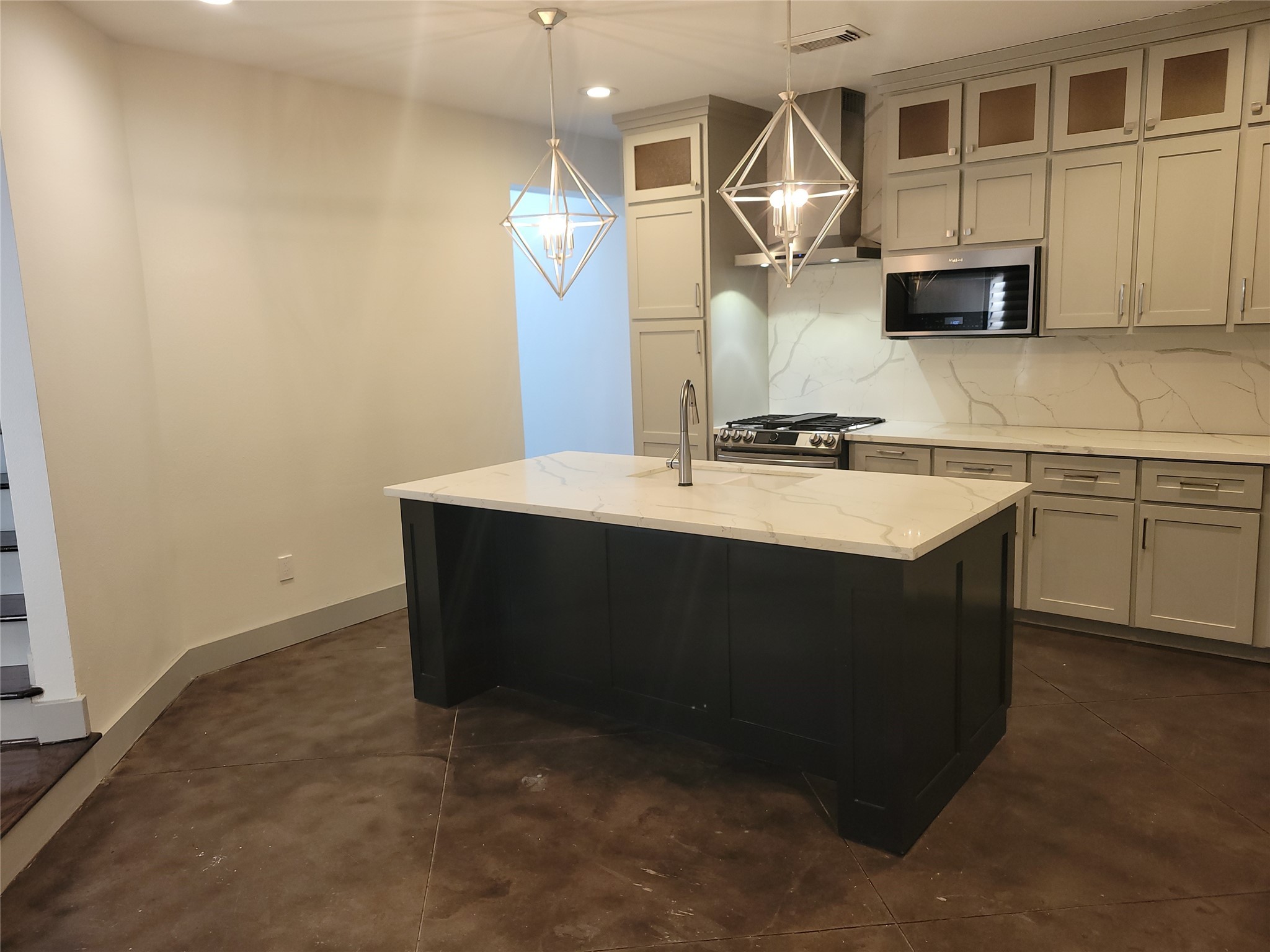 4914 Rose Street Houston, TX 77007 - Photo 2 of 36 a kitchen with kitchen island a sink stainless steel appliances and cabinets