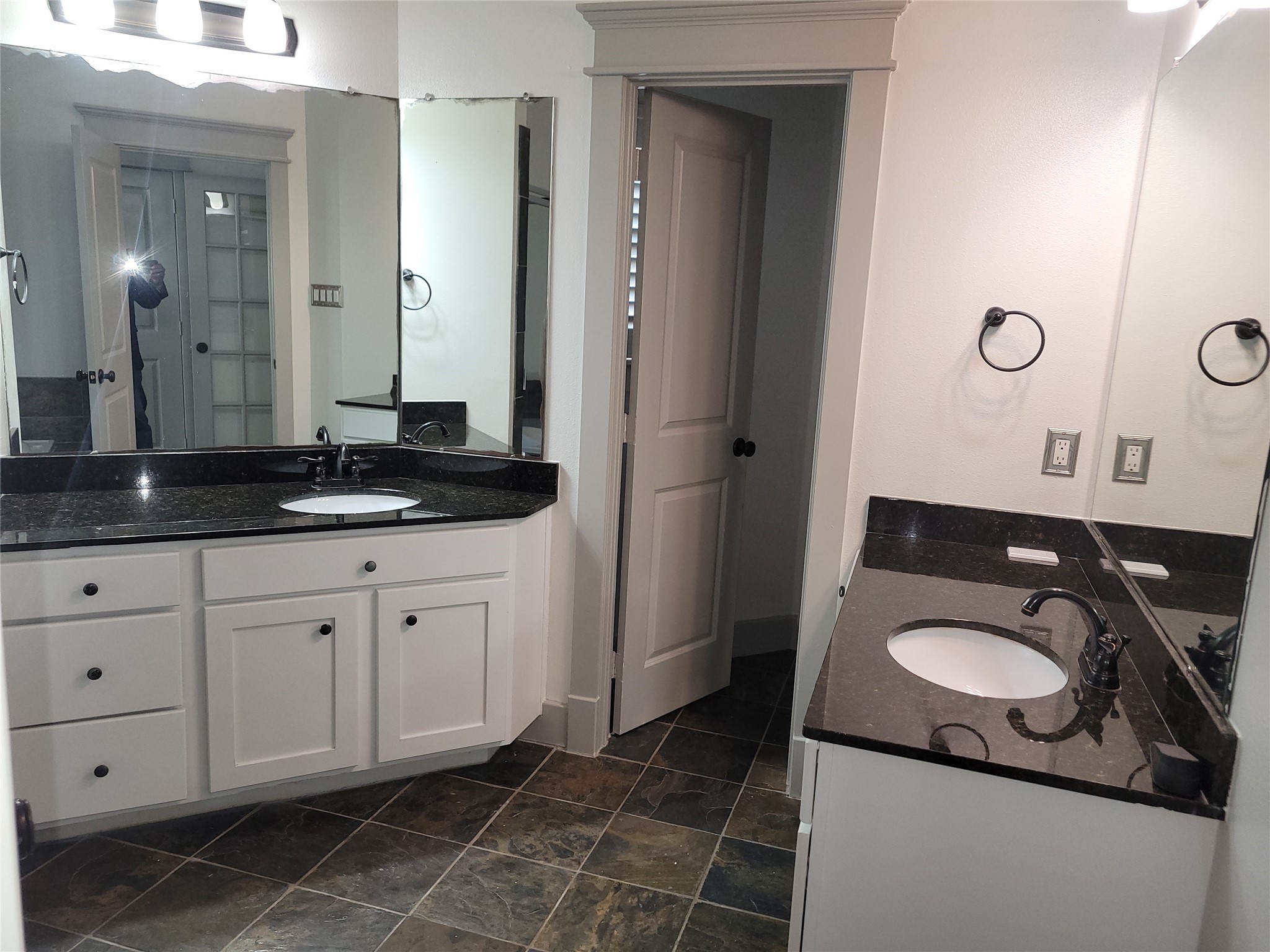 4914 Rose Street Houston, TX 77007 - Photo 23 of 36 a bathroom with a granite countertop sink a toilet and a mirror
