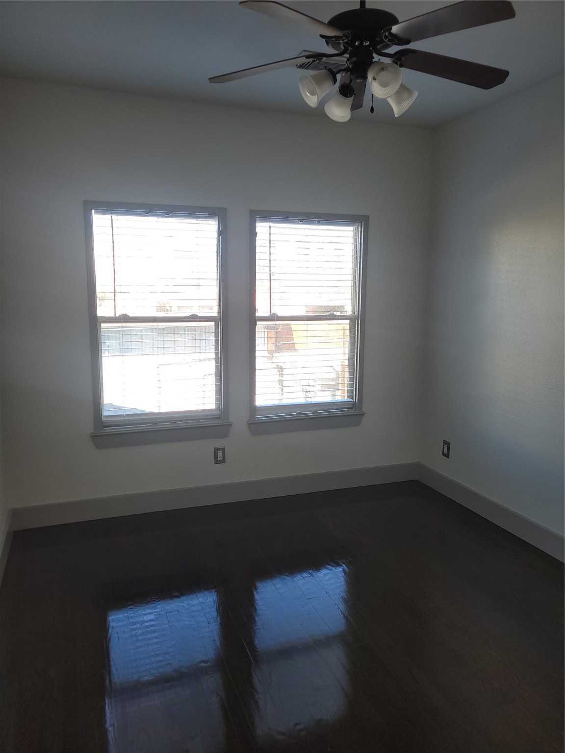 4914 Rose Street Houston, TX 77007 - Photo 29 of 36 a view of an empty room with wooden floor and a window