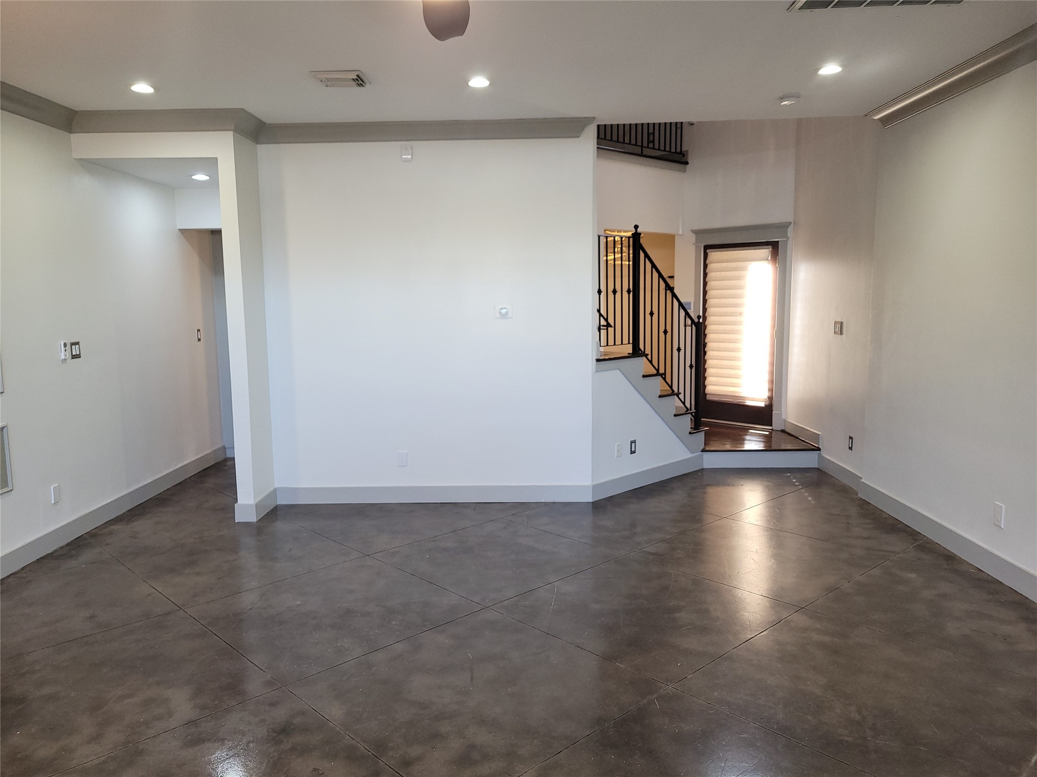 4914 Rose Street Houston, TX 77007 - Photo 7 of 36 an empty room with wooden floor and windows
