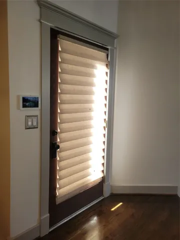 a view of staircase with railing and a rug