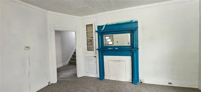 a hallway with sink and a mirror