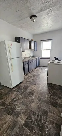 a large white bed in a white room