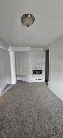 a view of empty room with a ceiling fan