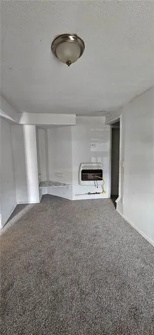 a view of empty room with a ceiling fan