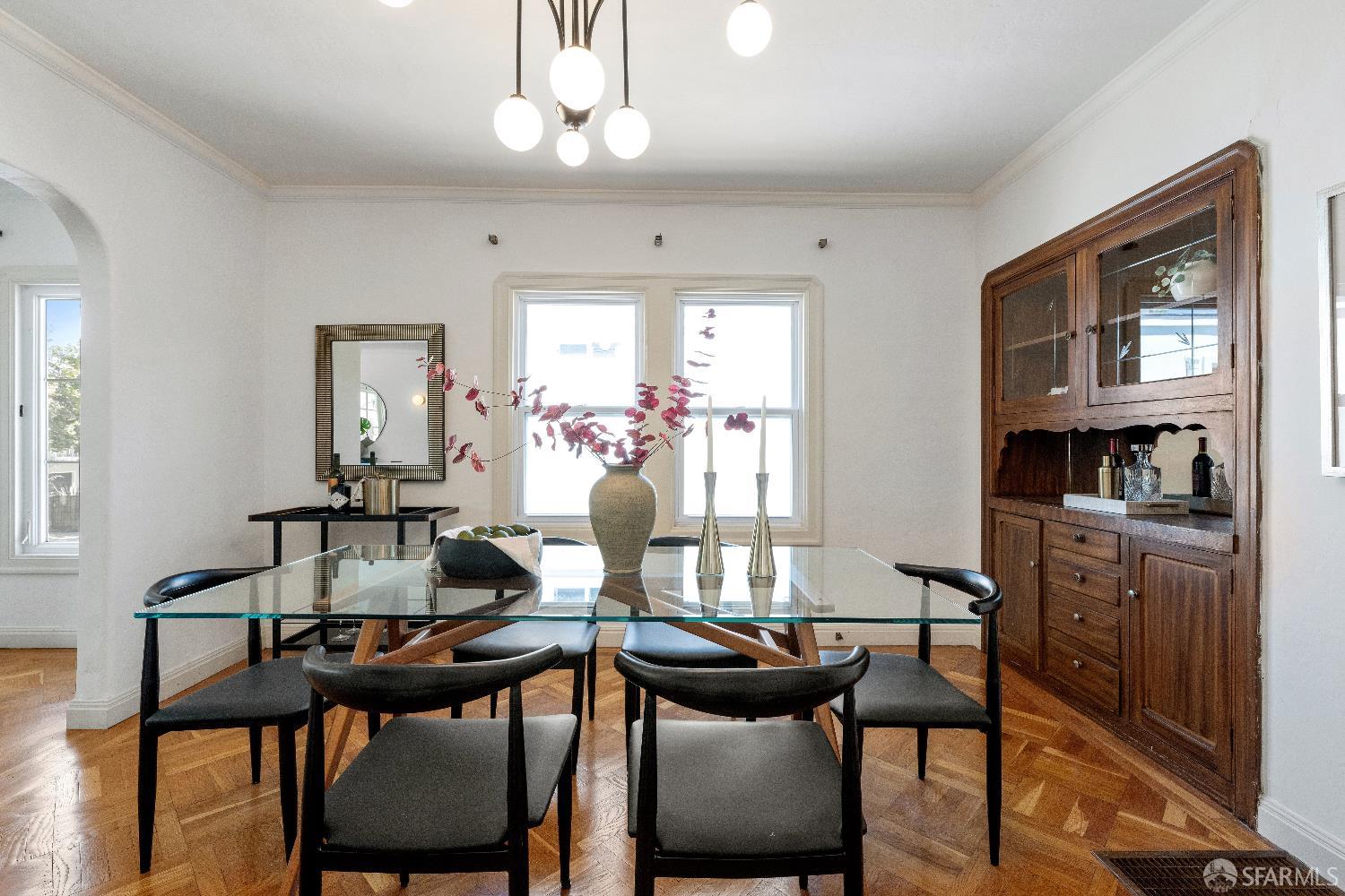 1475 Stannage Avenue Berkeley, CA 94702 - Photo 14 of 59 a view of a dining room with furniture window and wooden floor