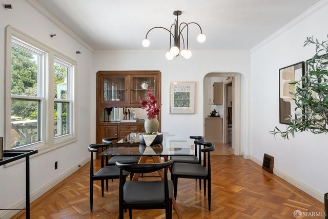 a dining room with furniture and window