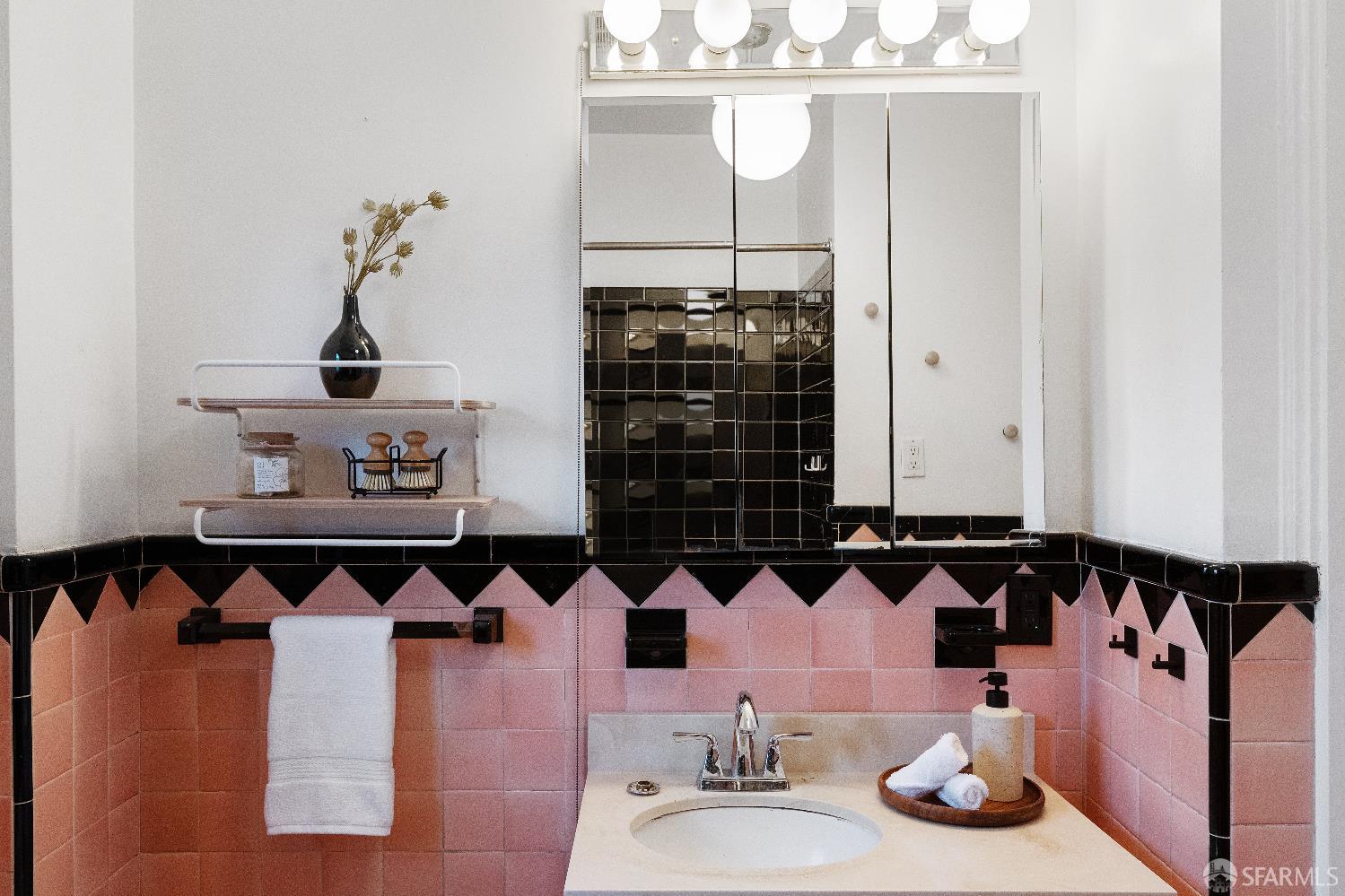 1475 Stannage Avenue Berkeley, CA 94702 - Photo 27 of 59 a bathroom with a sink and a mirror