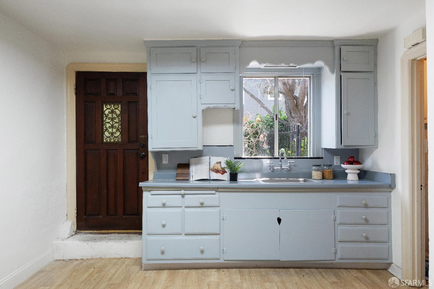 1475 Stannage Avenue Berkeley, CA 94702 - Photo 41 of 59 a kitchen with stainless steel appliances a sink stove and cabinets