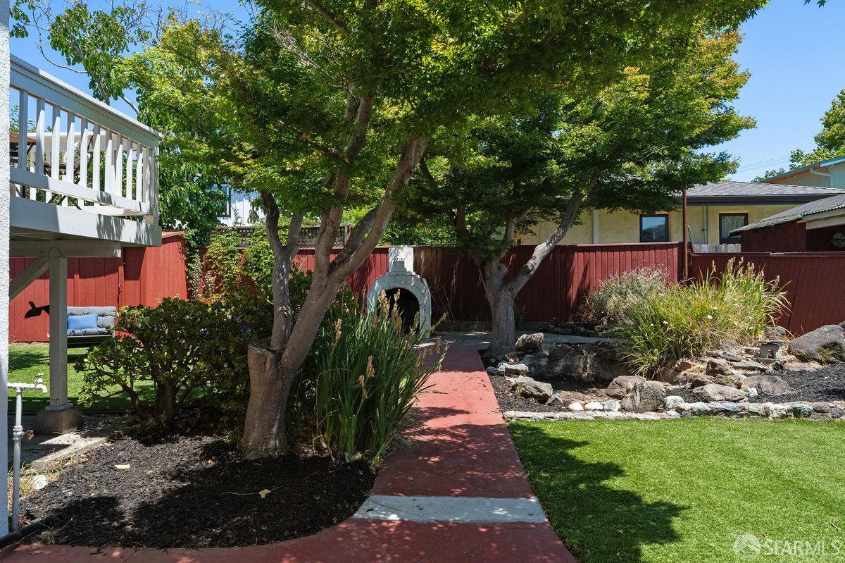 1475 Stannage Avenue Berkeley, CA 94702 - Photo 52 of 59 a view of a pathway with a house in the background