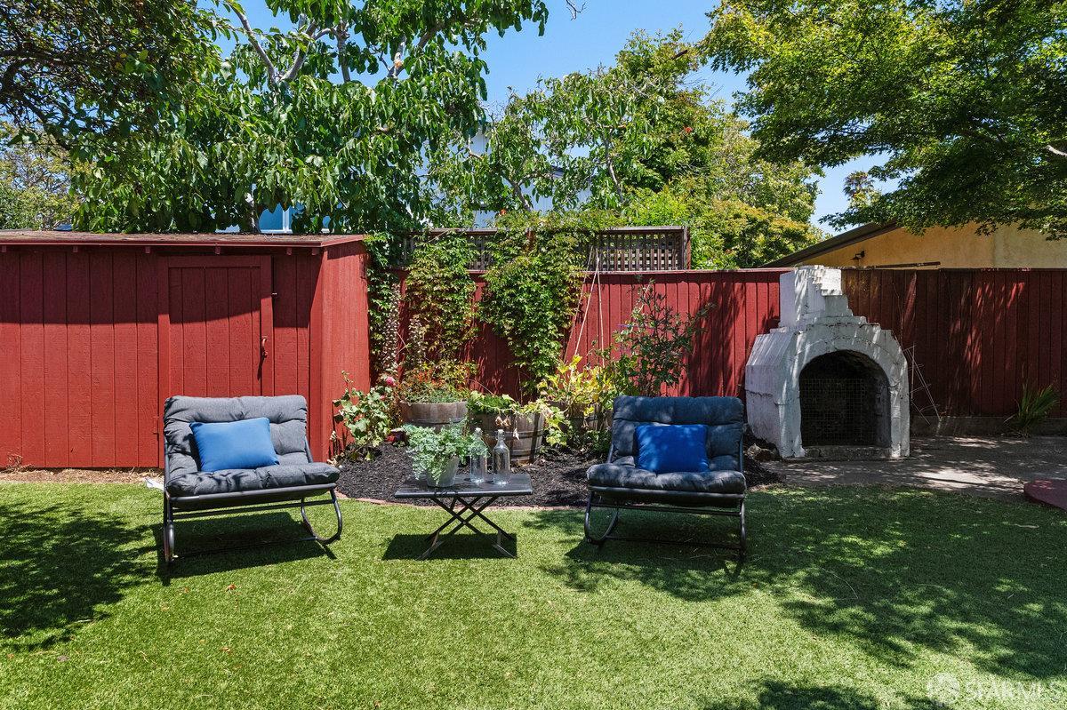 1475 Stannage Avenue Berkeley, CA 94702 - Photo 53 of 59 a backyard of a house with yard fire pit and outdoor seating