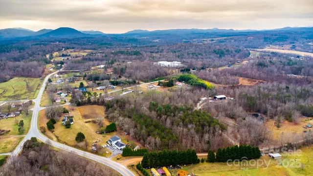 an aerial view of residential houses and outdoor space