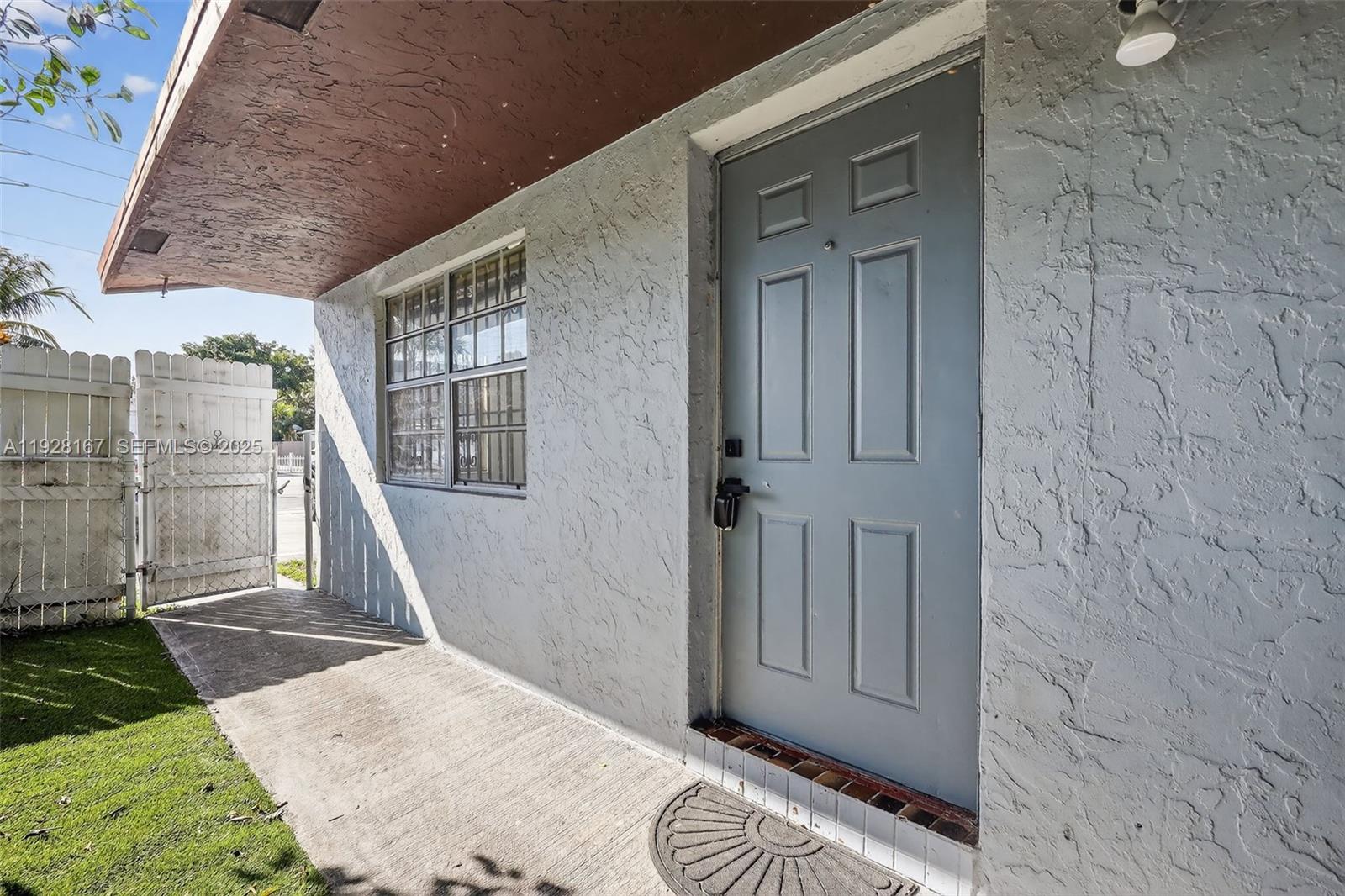708 Southwest 10th Street, Unit 1 Dania Beach, FL 33004 - Photo 18 of 23 front view of a house with a glass door