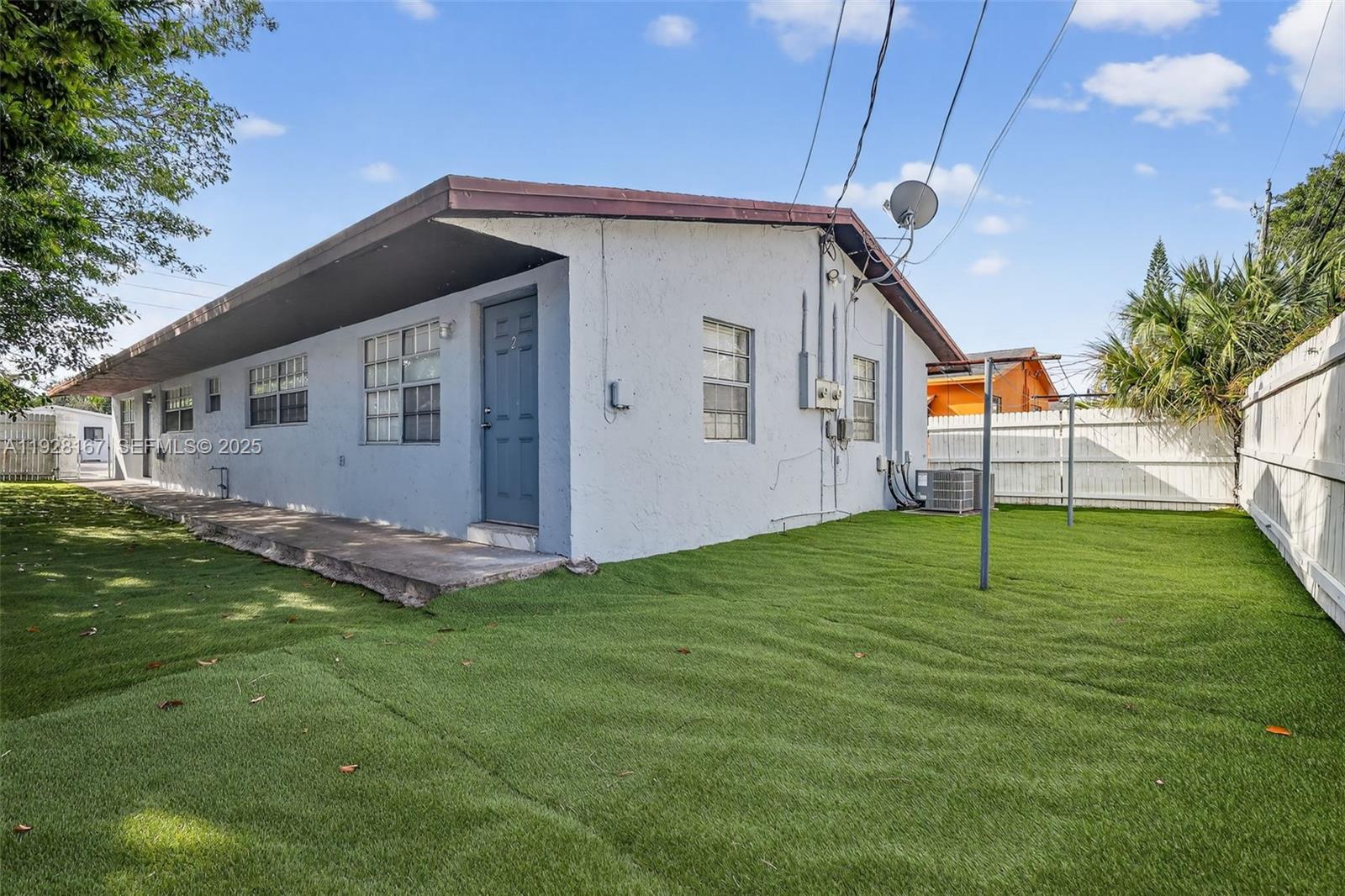 708 Southwest 10th Street, Unit 1 Dania Beach, FL 33004 - Photo 21 of 23 a view of a backyard of the house