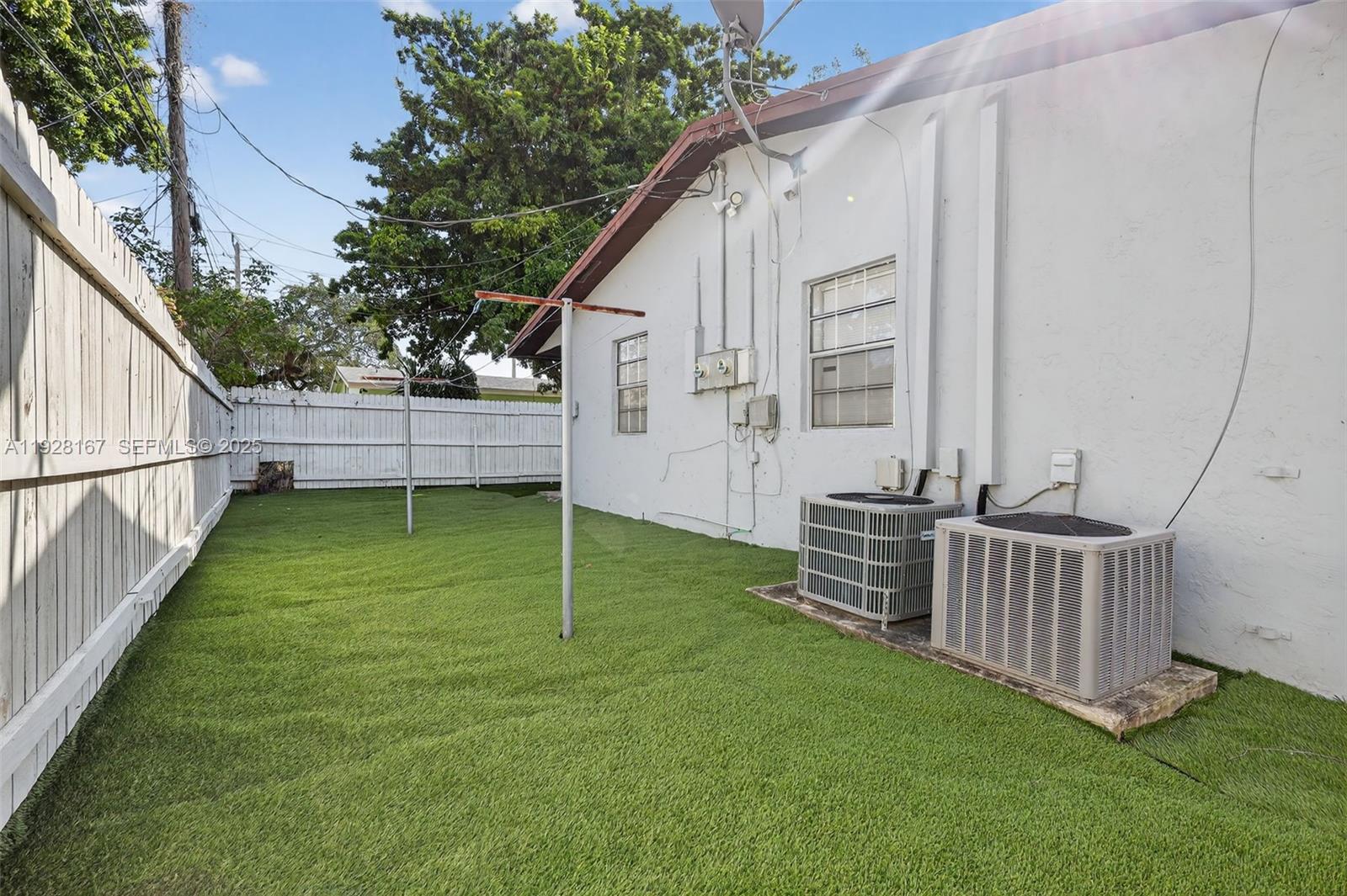 708 Southwest 10th Street, Unit 1 Dania Beach, FL 33004 - Photo 22 of 23 a view of a backyard with a garden